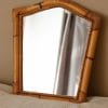 Ancien miroir en rotin, décoration vintage, charme rétro, miroir déco naturel, style bohème.
